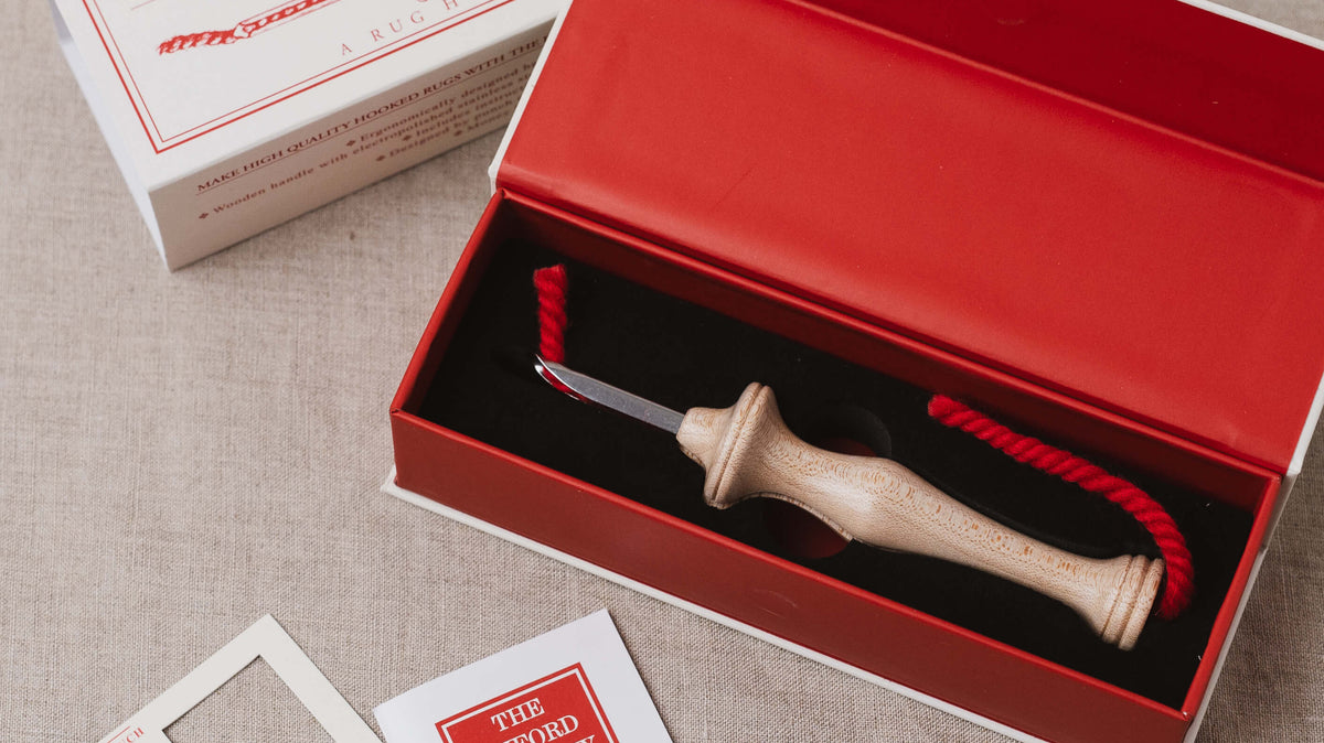 oxford regular punch needle in red box with quick guide and stitch gauge just out of shot