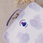 Zipper pouch with floral design and 'Violet Jane Yarn' branding on a beige background