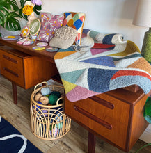 Load image into Gallery viewer, whole punching finished punch needle projects on display in home studio for workshop
