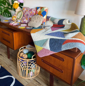 whole punching finished punch needle projects on display in home studio for workshop