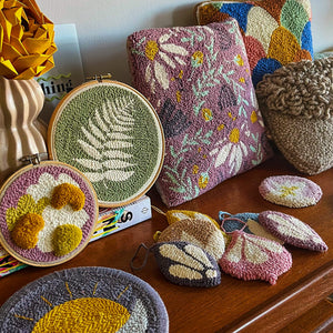 whole punching finished punch needle projects on display
