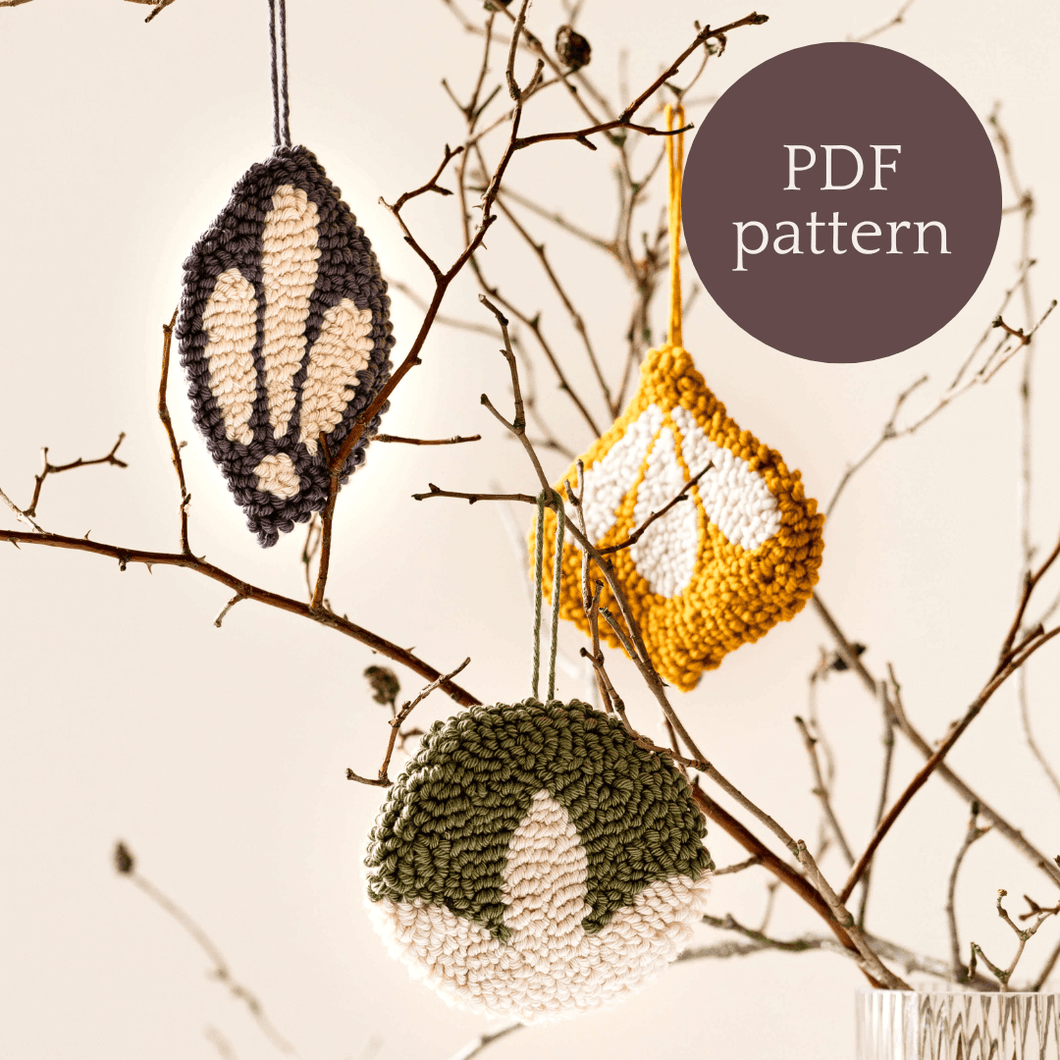 punch needle baubles hanging from a tree pdf pattern text overlaid in a circle